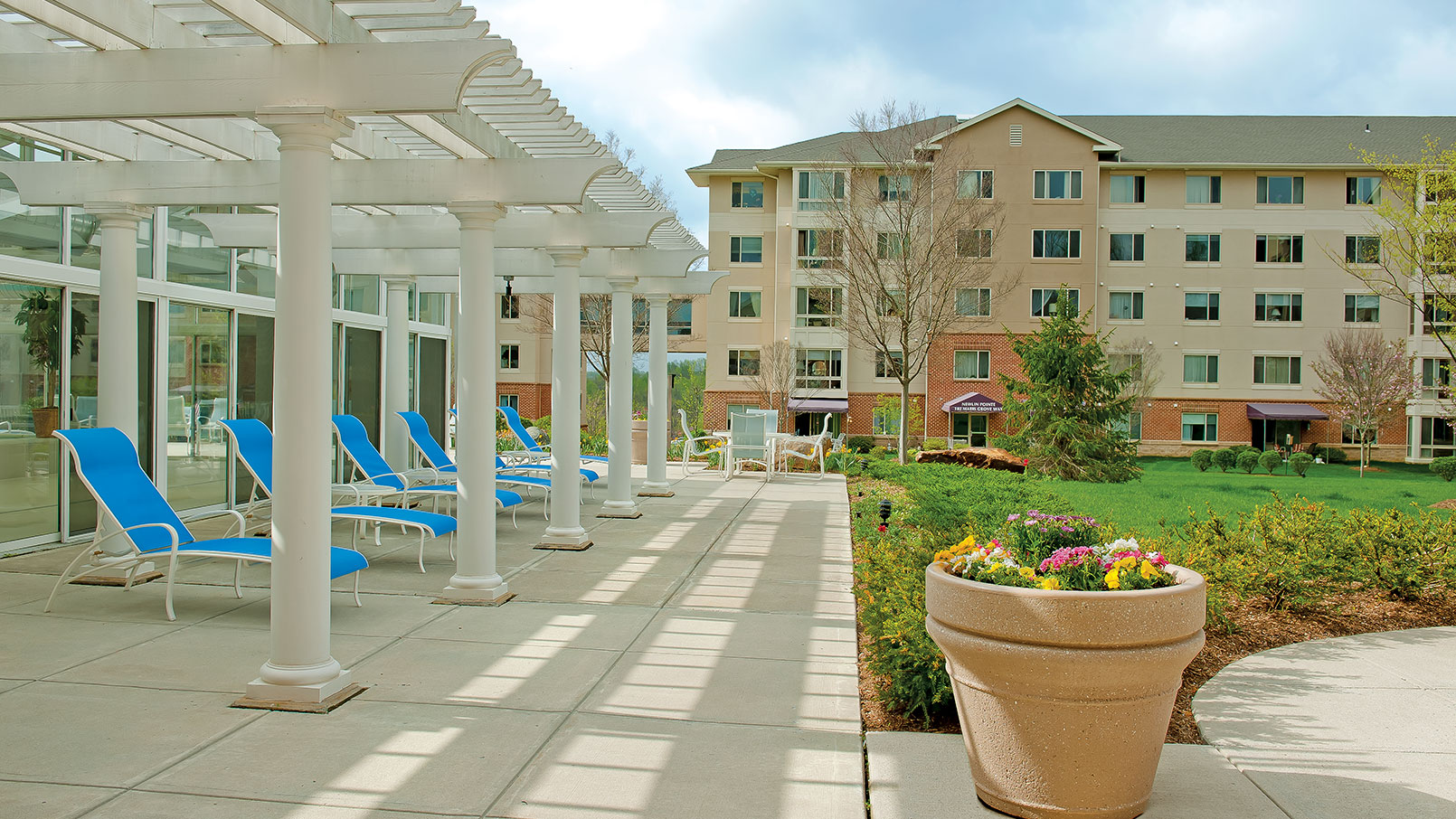 Poolside view of exterior Maris Grove building.