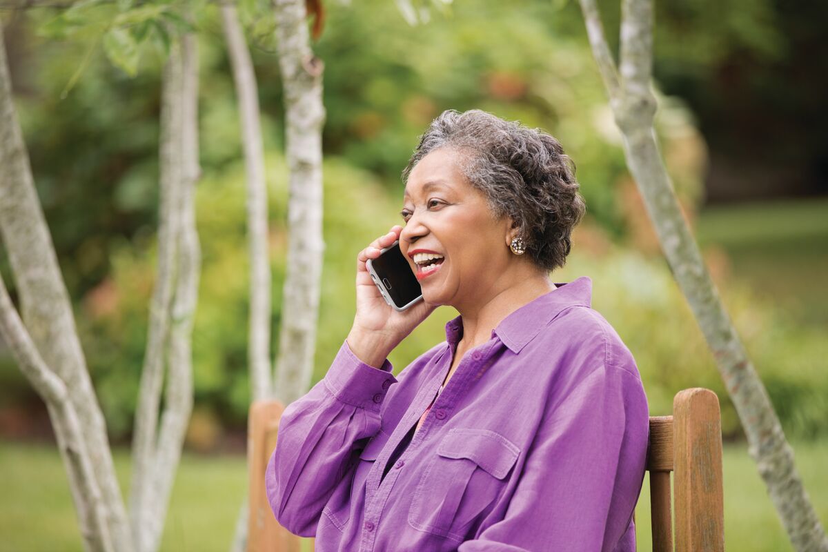 social_distance A woman speaks on her cell phone outdoors
