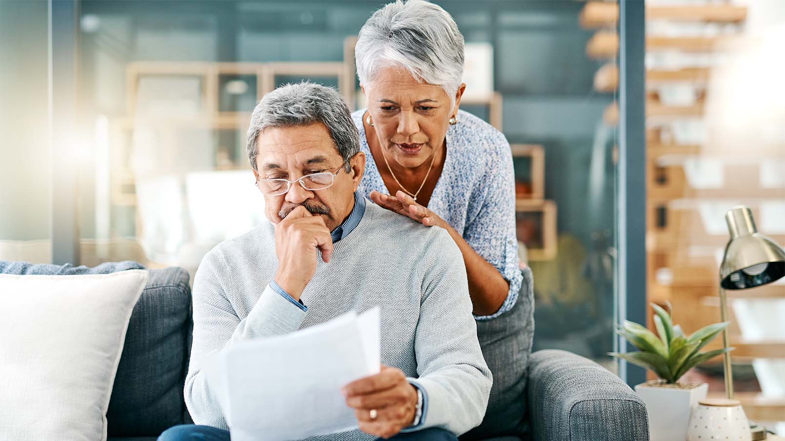 GettyImages-1139792625_1610x906 a couple looking at paperwork