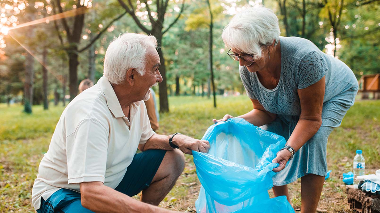 GettyImages-1160028970_1610x906 man and woman collecting trash