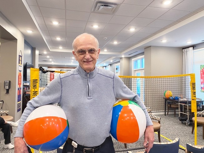 Residents at Windsor Run prepare for a game of chair volleyball, one of the many activities enjoyed at the Erickson Senior Living community.