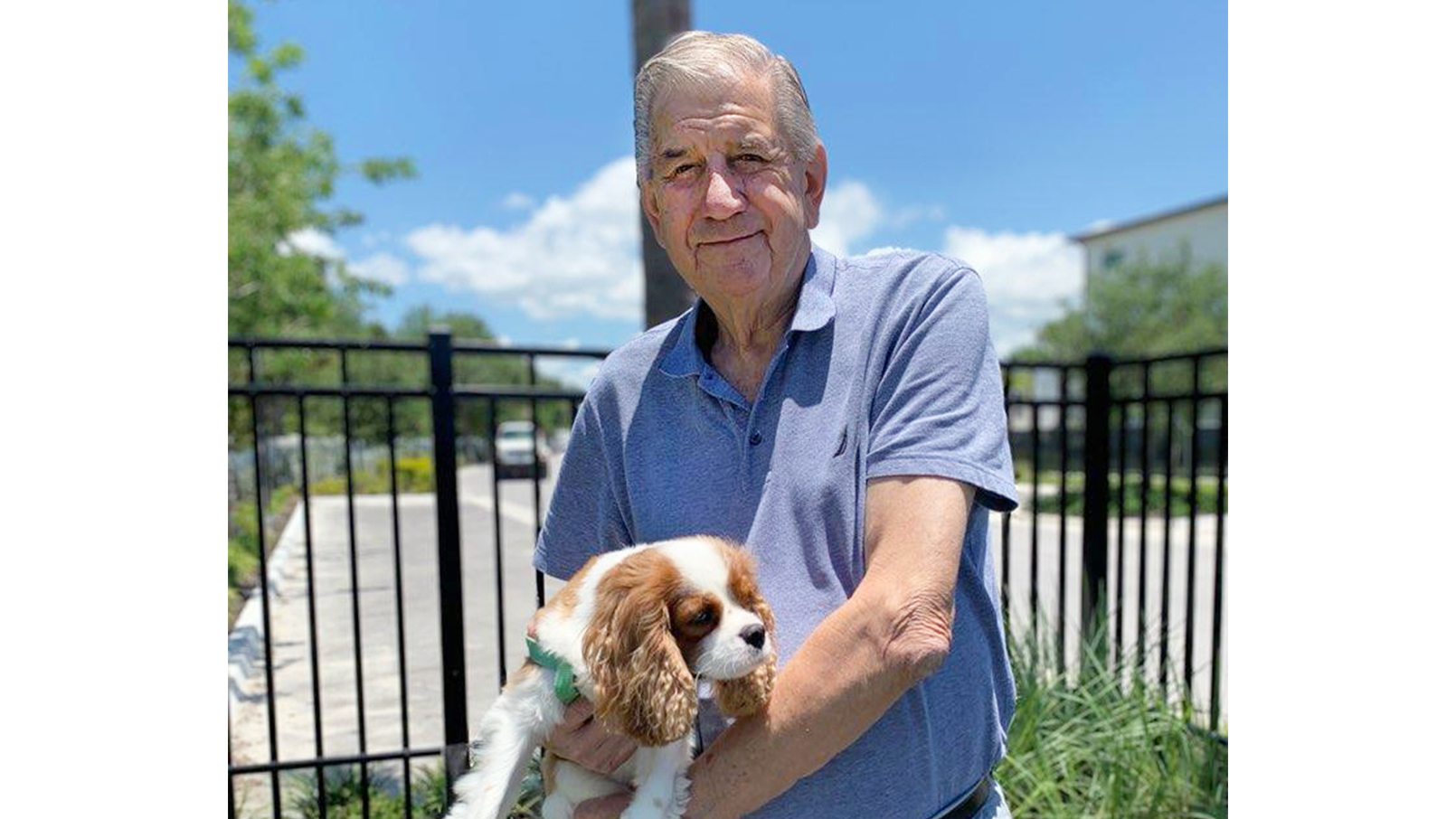 resident Bryan Gibbs holding his dog named Archie