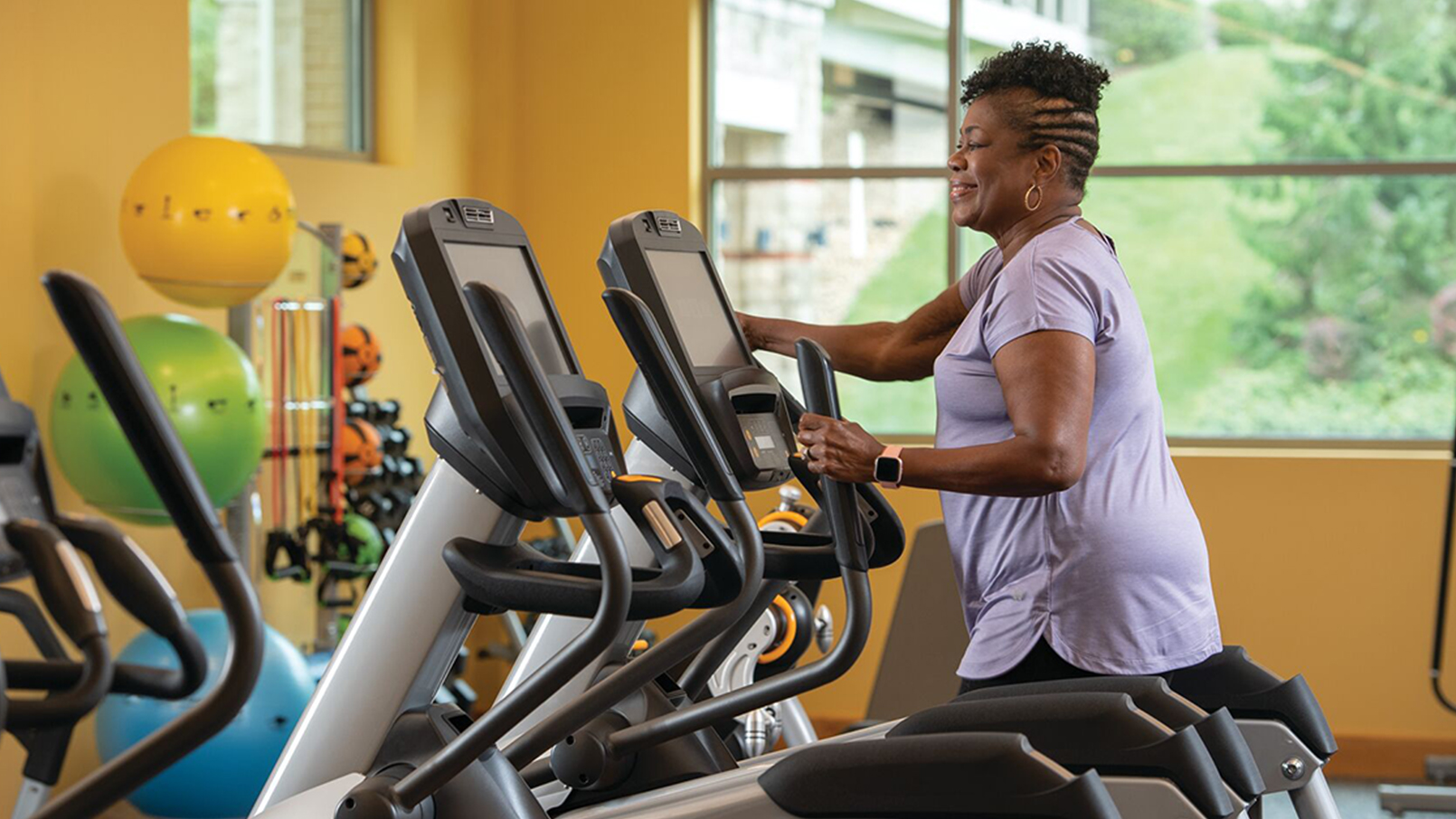 Woman on gym equipment