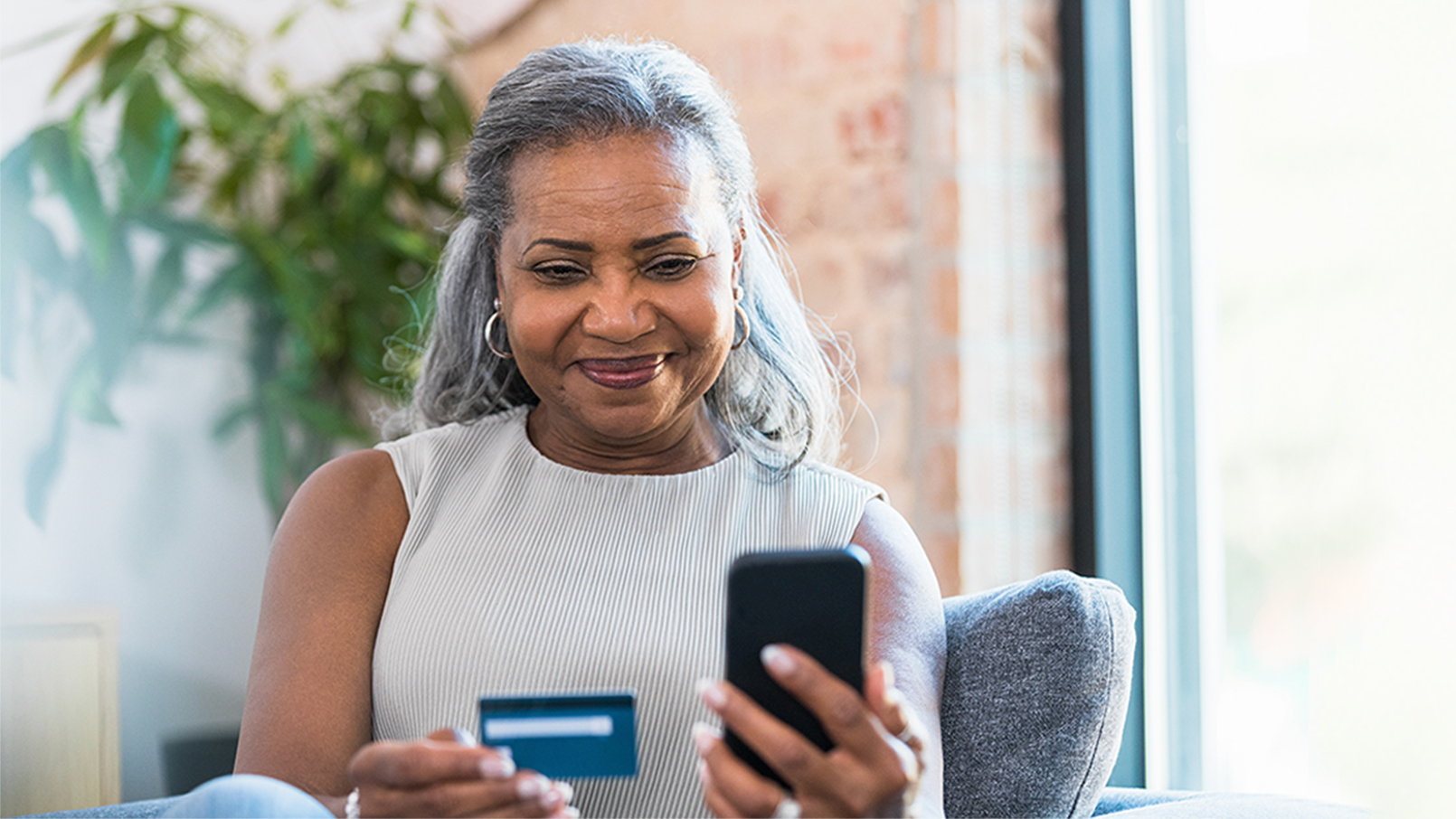 Women with bank card and smartphone