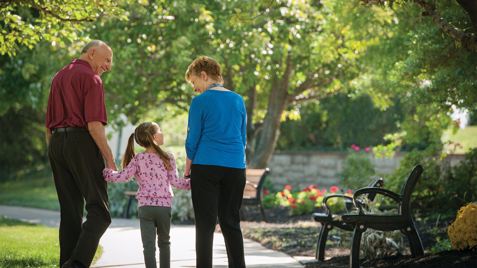 Grandparents walking with child