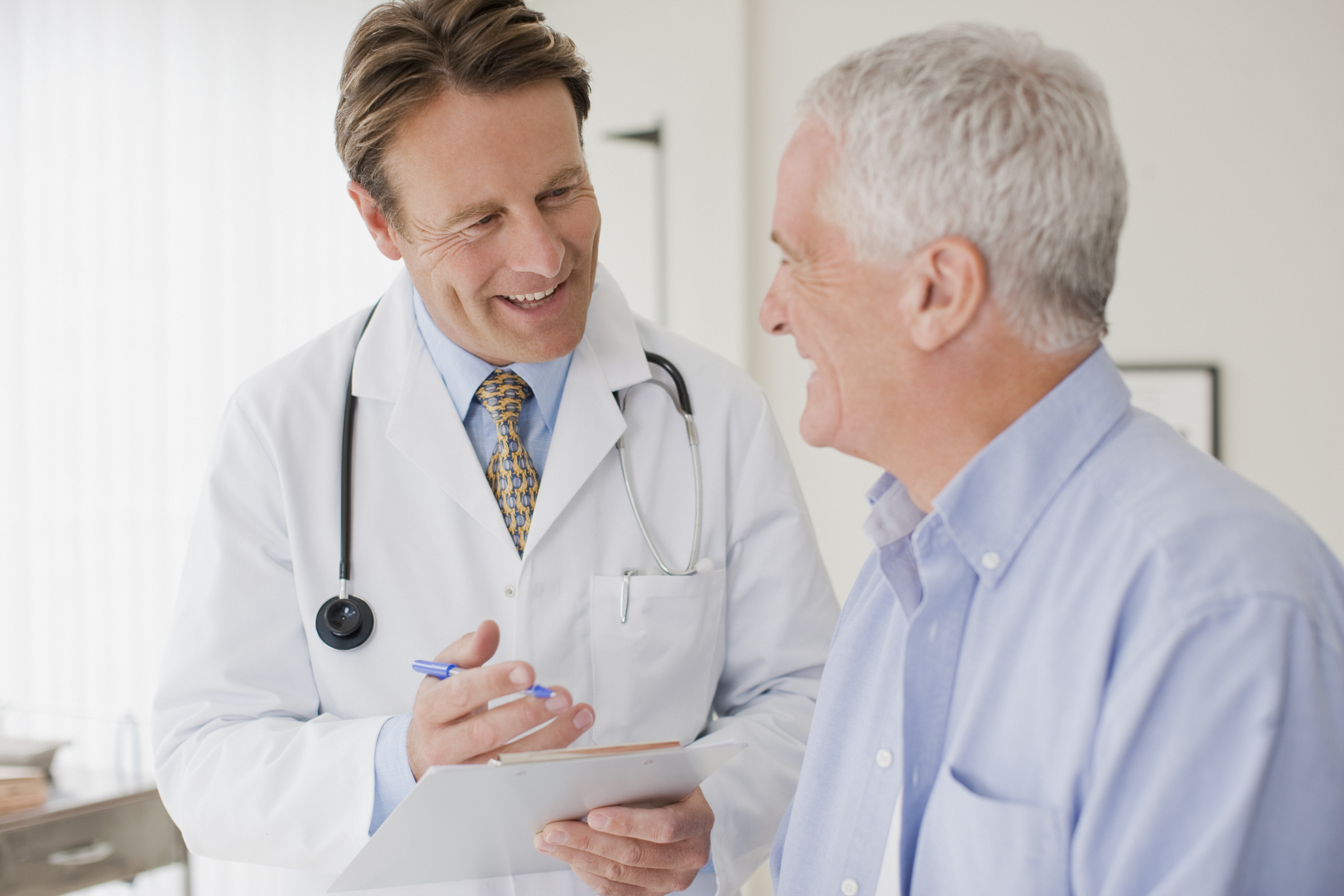 senior man talking with doctor