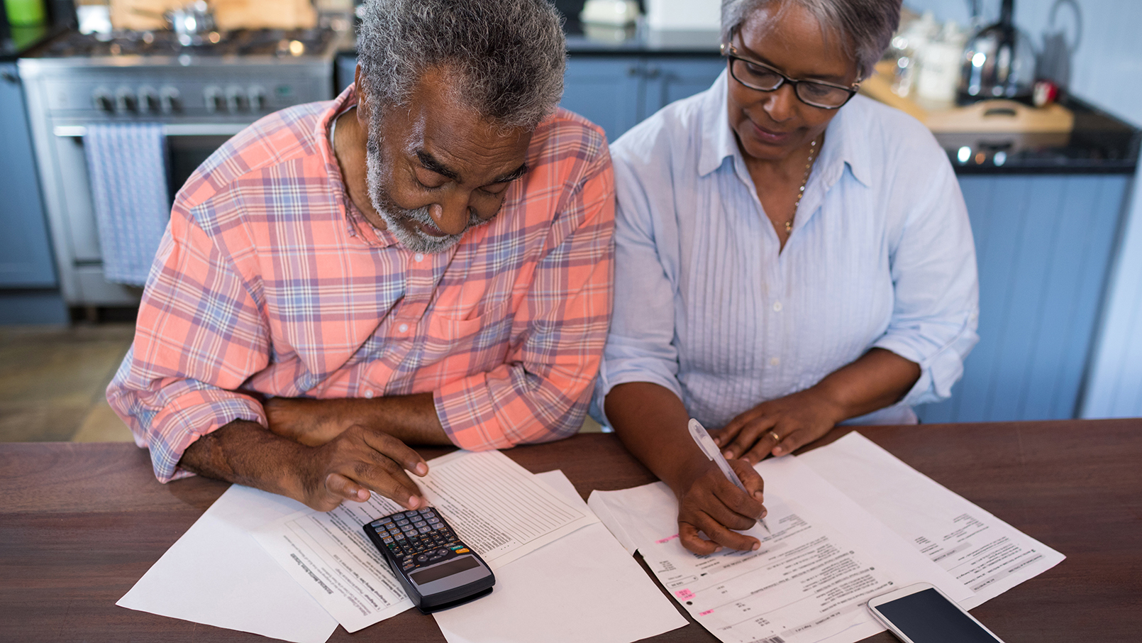 senior couple going through paperwork