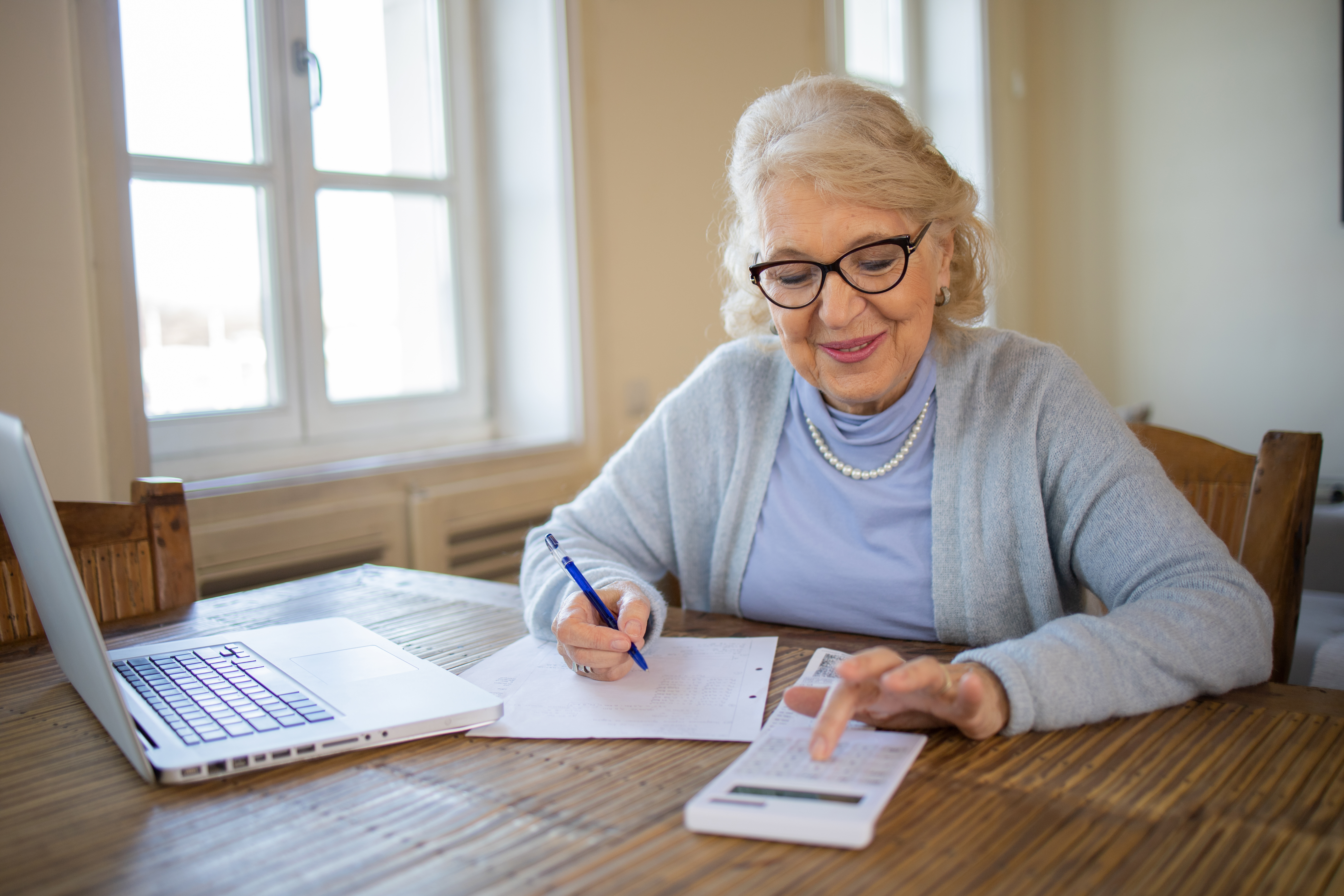 senior woman going through a budget