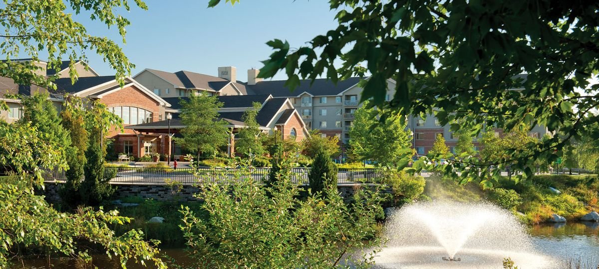 View of fountain in front of Brooksby Village building.