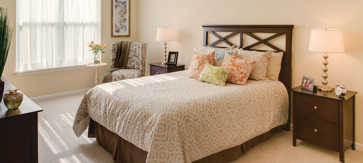 Large bedroom with window.