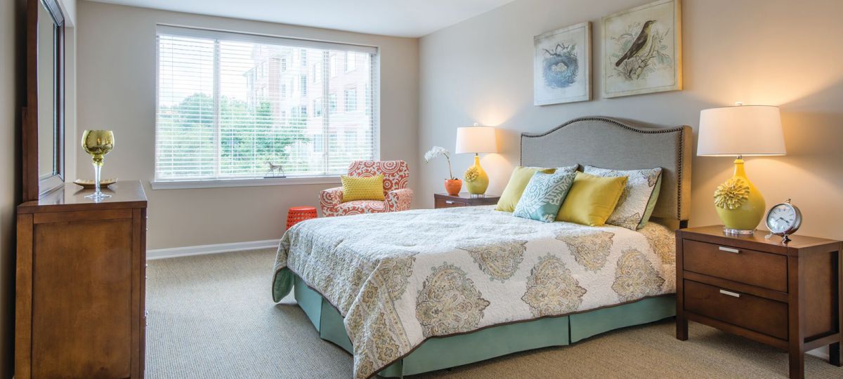 Image of a large bedroom with plenty of natural light.
