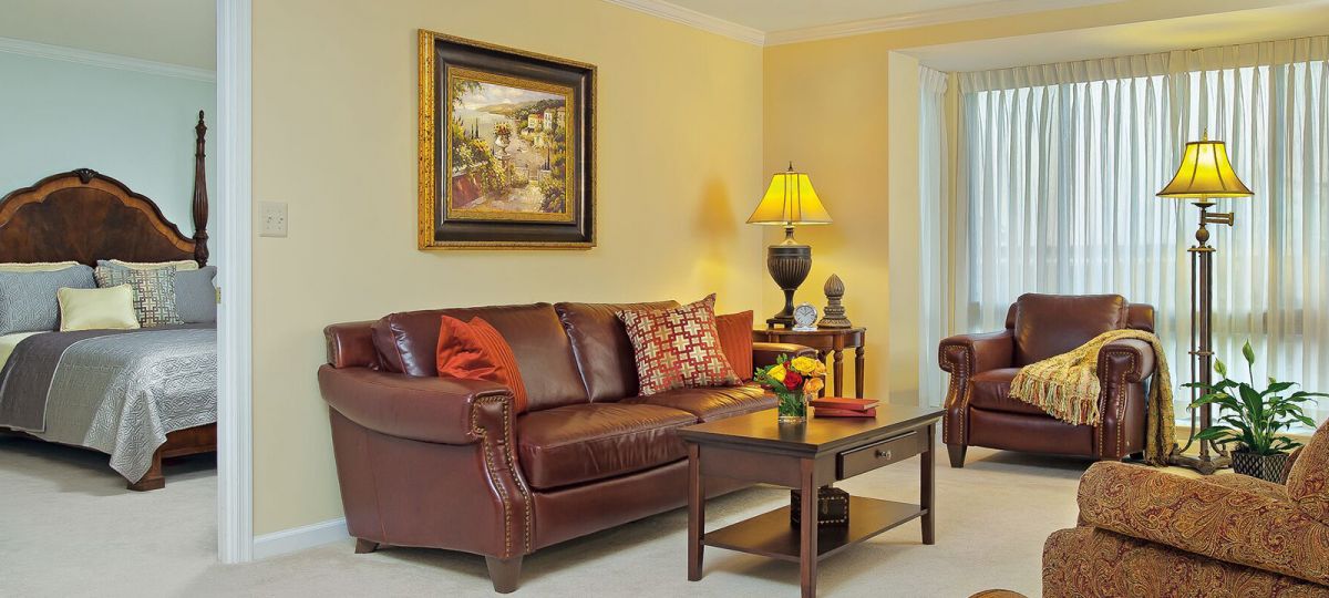 Open concept living room with large windows.