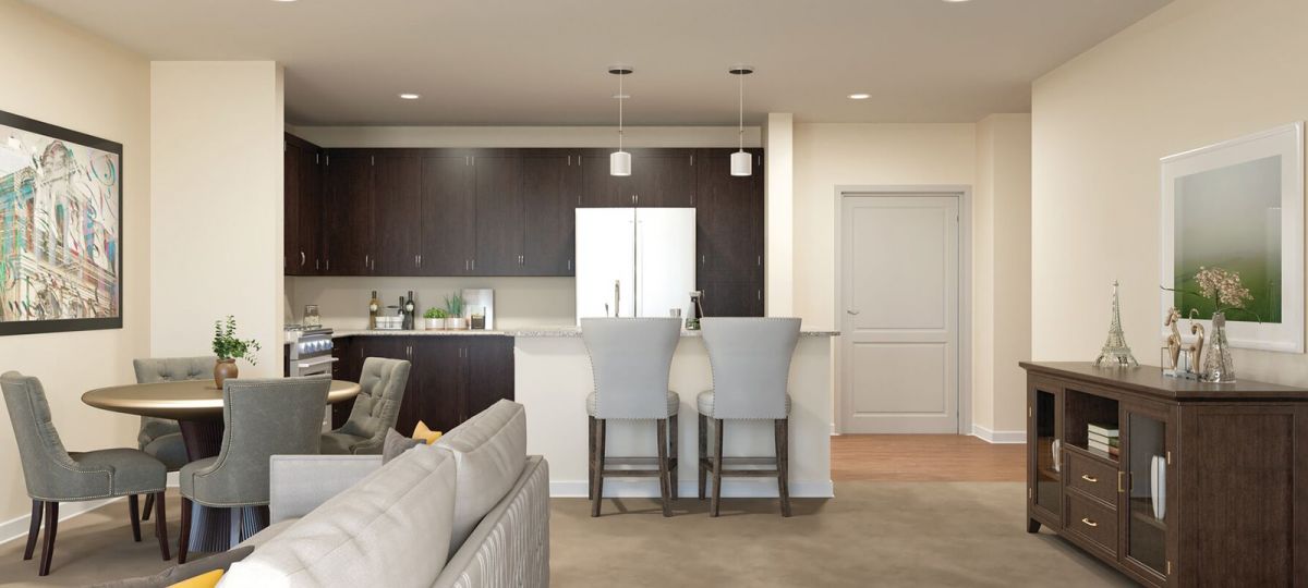 Combined living and dining area of a tastefully decorated apartment.