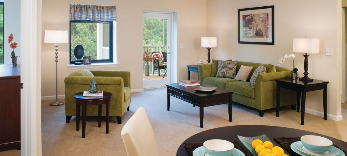 Living room with couch, coffee table, chair and table