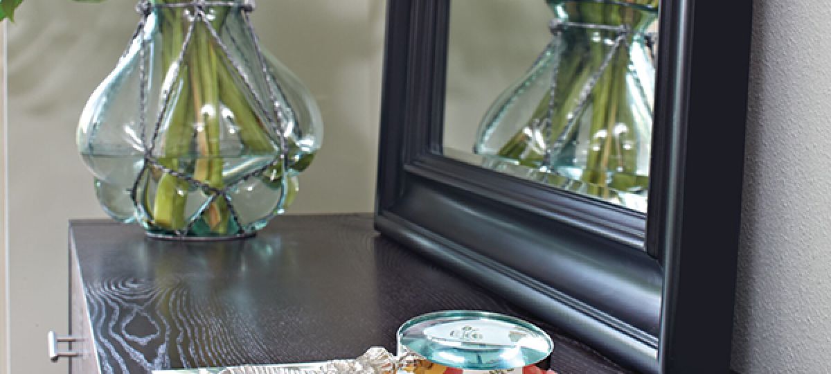 Mirror and plant in corner