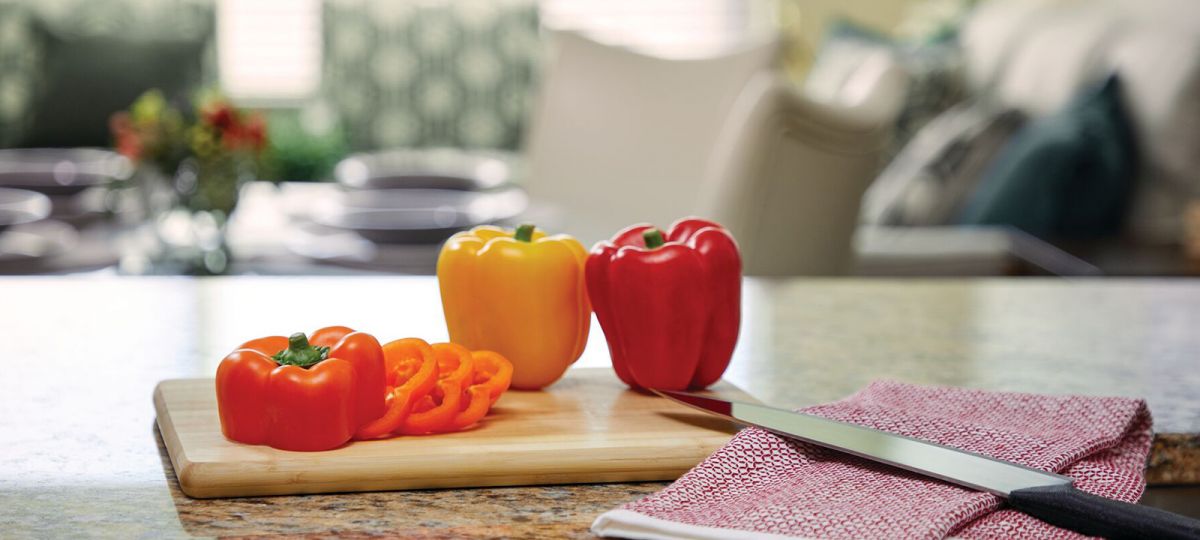 Close up of food preparation in the kitchen in Mulberry apartment home.