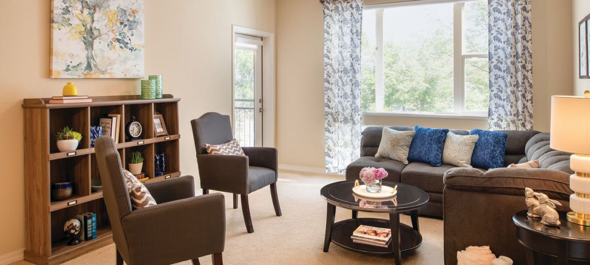 Open living room with styled bookshelf.