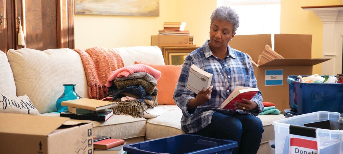 A senior organizes her household before a move