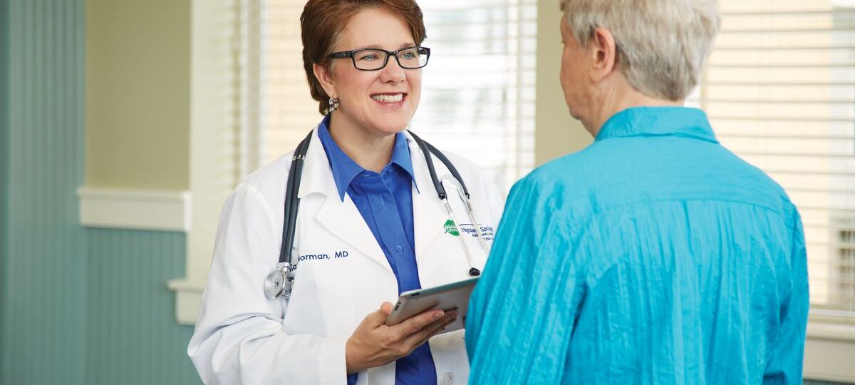 Senior living doctor consults with a resident