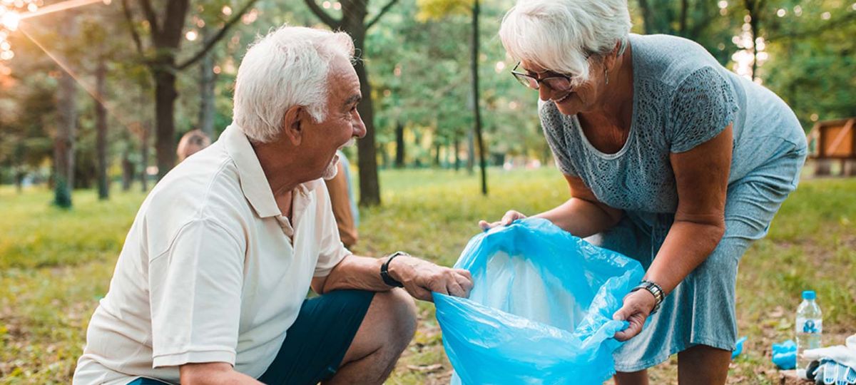GettyImages-1160028970_1610x906 man and woman collecting trash