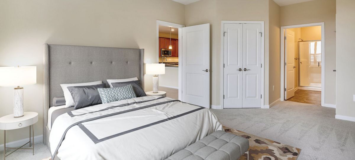 Interior shot of a cozy master bedroom in an Erickson one-bedroom apartment.