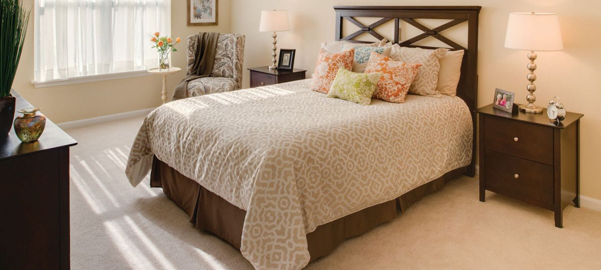 Cozy, bright, furnished bedroom in a second-bedroom apartment.