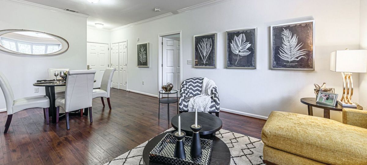 Interior shot of a nicely decorated, open living room in an Erickson two-bedroom apartment home.