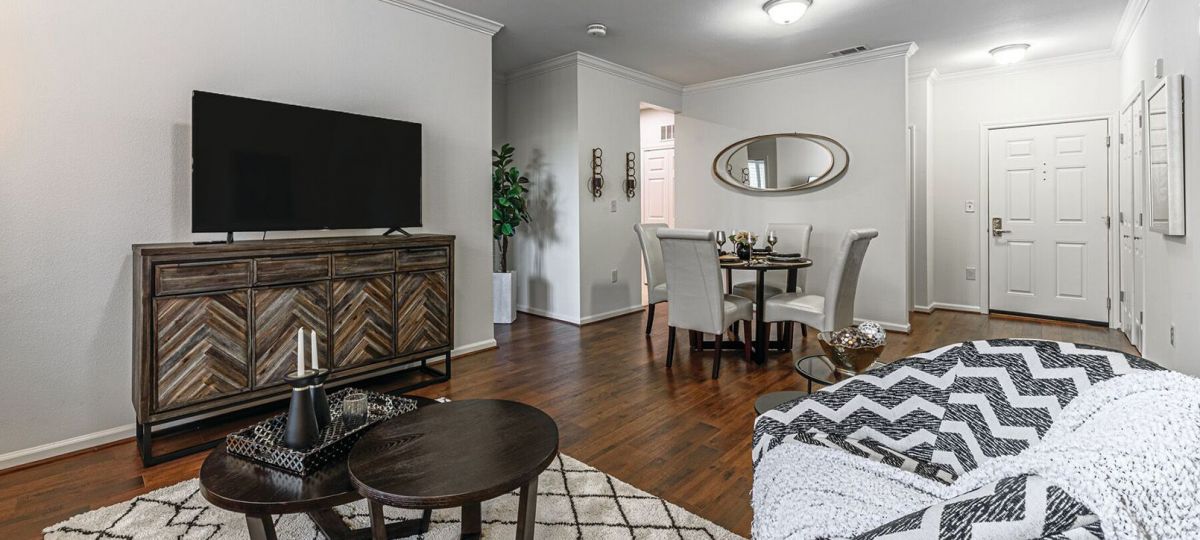 Interior shot of a nicely decorated, open living room in an Erickson two-bedroom apartment home.