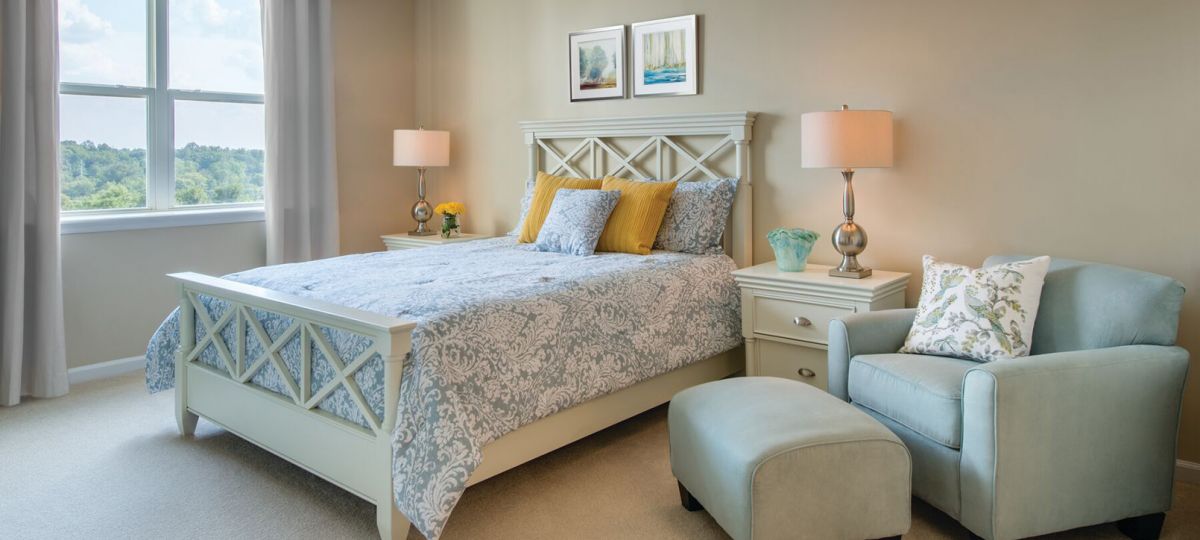 Interior shot of a cozy guest bedroom in an Erickson two-bedroom apartment.