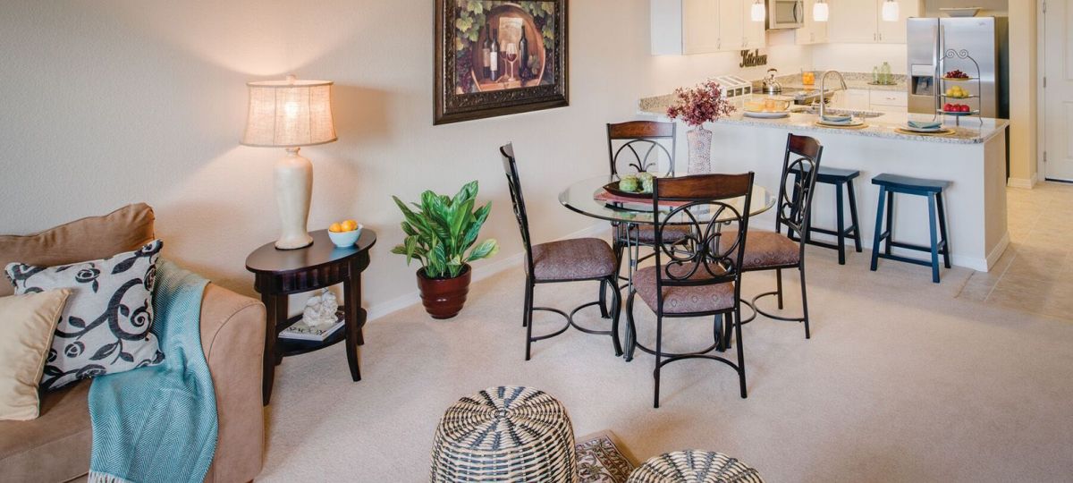 Interior shot of a nicely decorated, open living room in an Erickson two-bedroom apartment home.