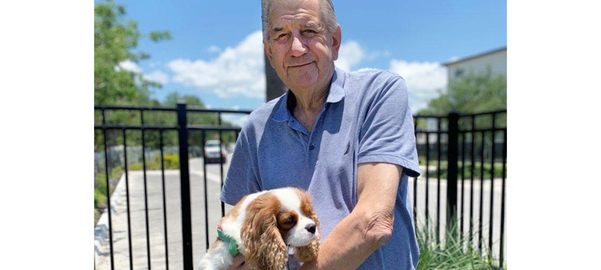 TRIB_SLN_0722_Pg7_Gibbs1_1610x906.jpg resident Bryan Gibbs holding his dog named Archie