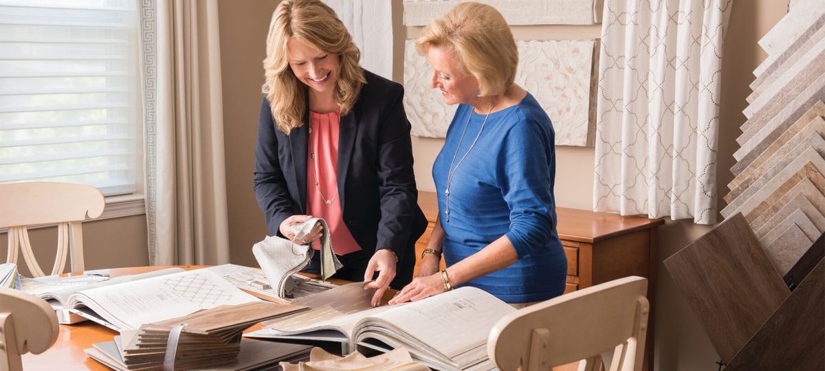 0922_ERMS_MGC_08_2017_1610x906_WEB_0.jpg Two women looking at designs