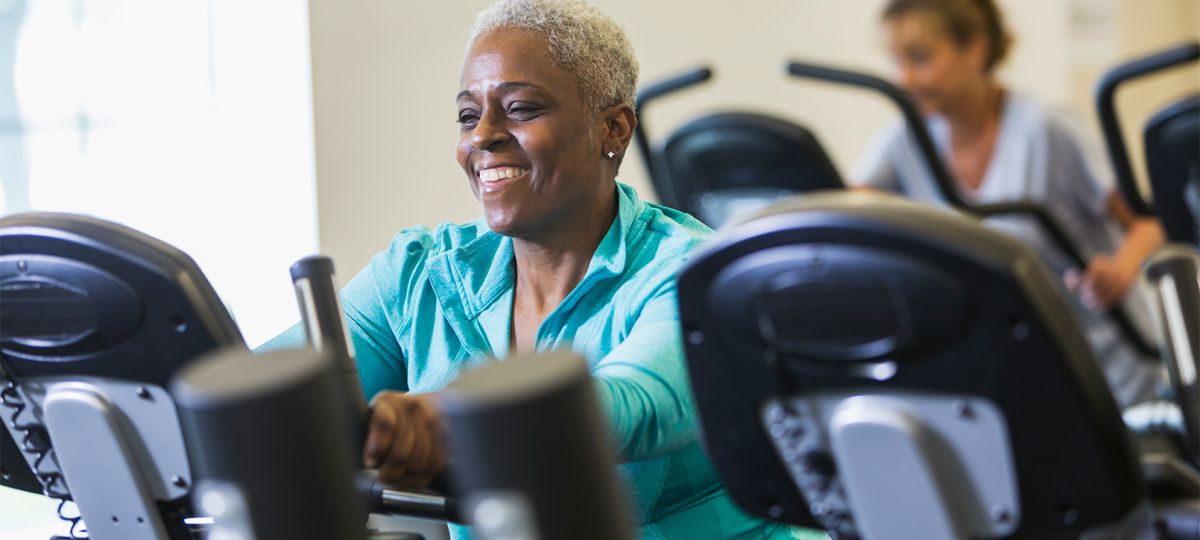 Health_0922_GettyImages-466656906_1610x906_WEB.jpg Woman on stationary bike
