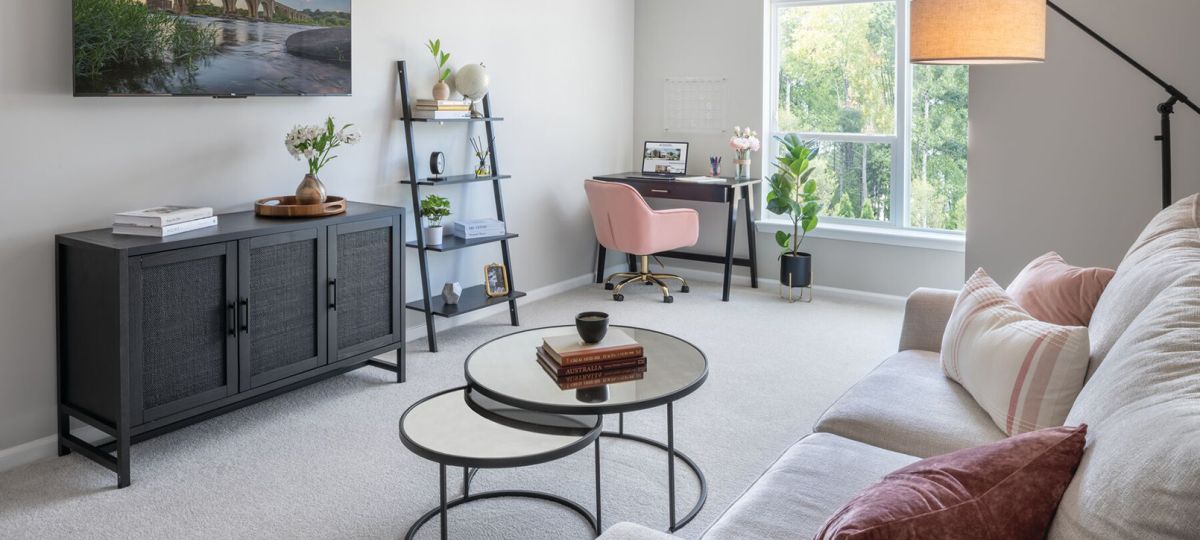 Interior shot of a nicely decorated living room in the Maplewood apartment.