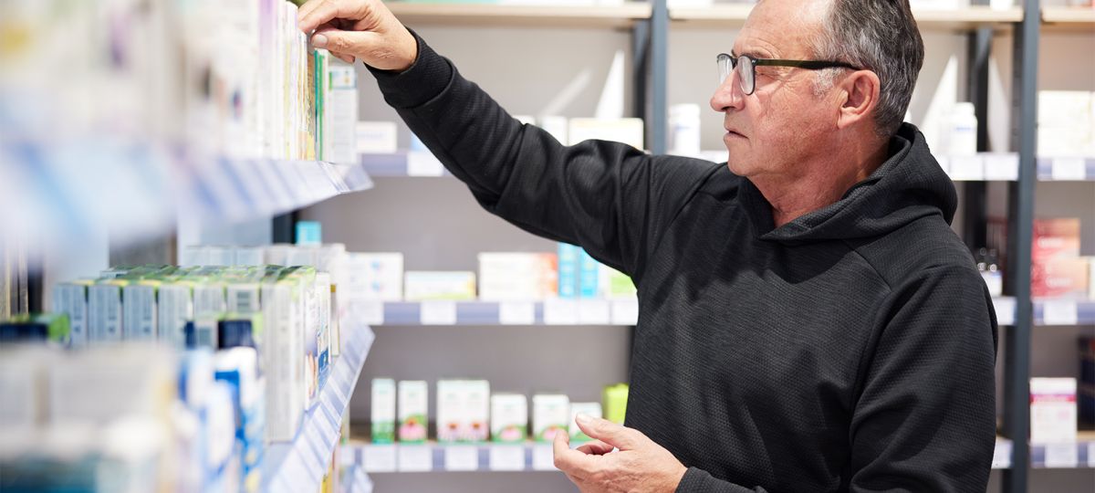 Health_1122_Vitamins_GettyImages-1356161053_1610x906_WEB.jpg Man shopping for vitamins