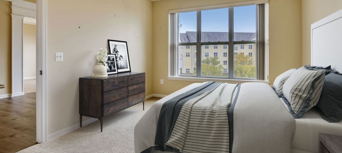 Spacious, furnished main bedroom in one-bedroom apartment.