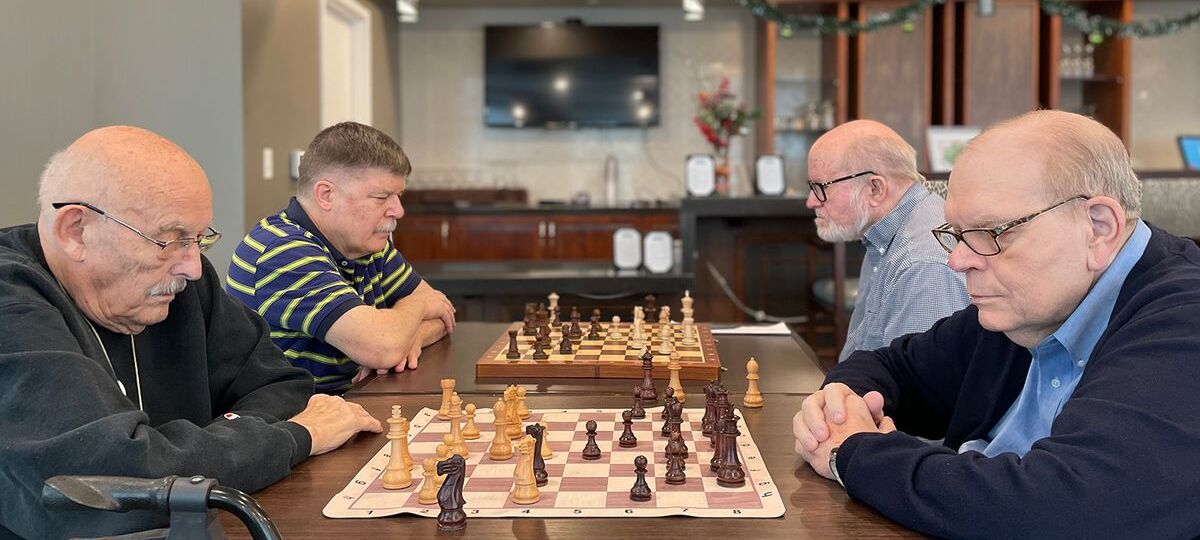 Residents at Windsor Run in Matthews, NC form many different clubs and groups, including one for those who enjoy chess.