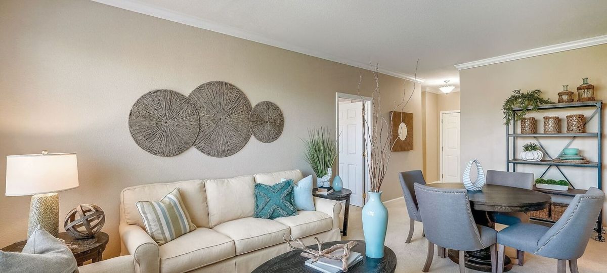 Wide angle shot of a spacious, open living room in an Erickson apartment.