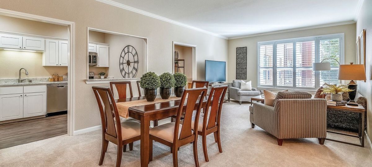 Interior shot of kitchen and dining area inside of an Erickson two-bedroom apartment home.