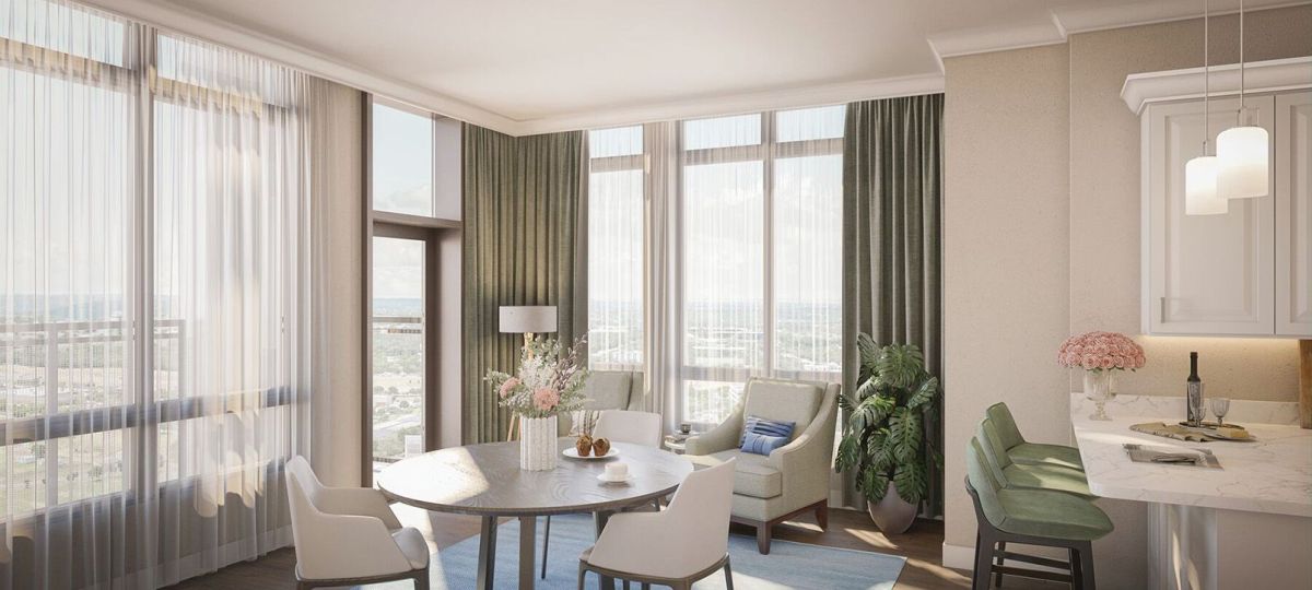 Wide angle shot of a spacious, open living room with corner balcony overlooking downtown Bethesda in an Erickson apartment.