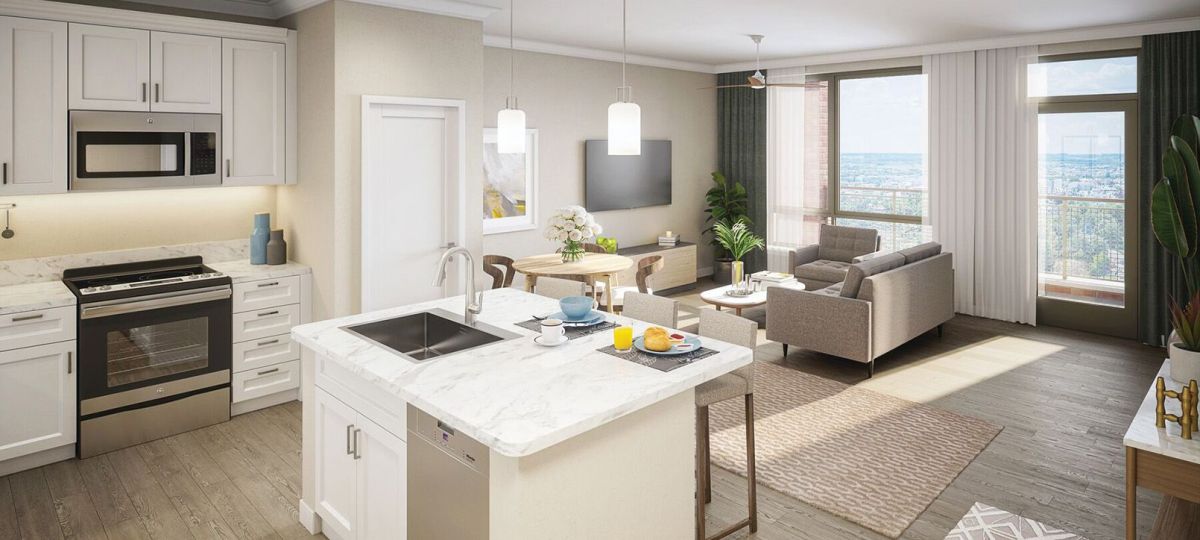 Wide shot of dining room and spacious, open living room.