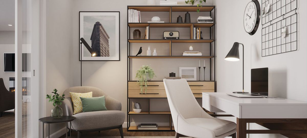 Cozy and versatile apartment den with comfortable seating, natural lighting, and a stylish workspace.