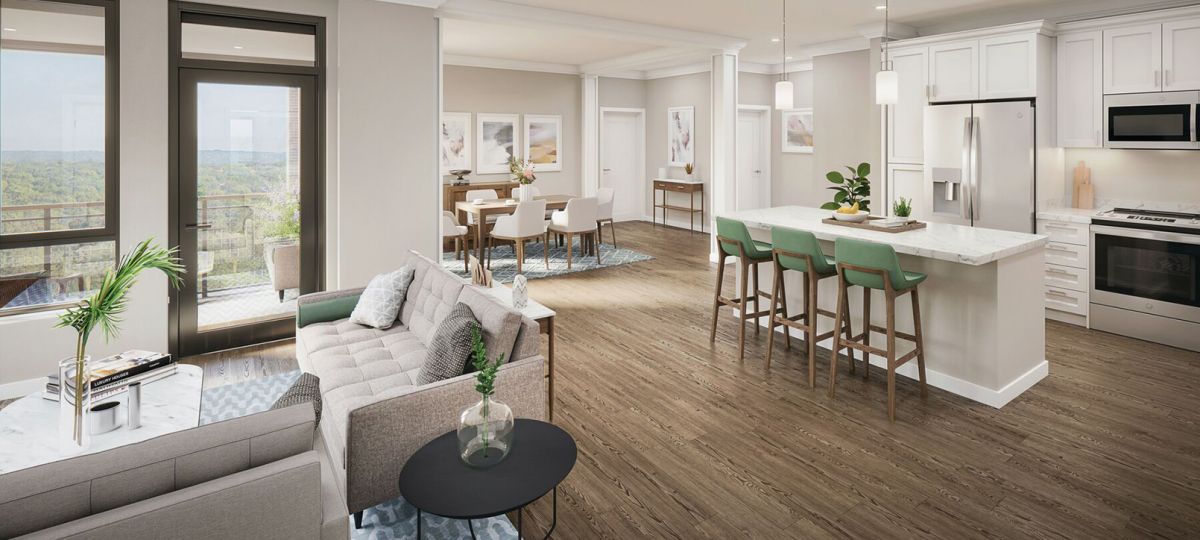 Spacious and inviting apartment living room with cozy seating, tasteful decor, and abundant natural light.