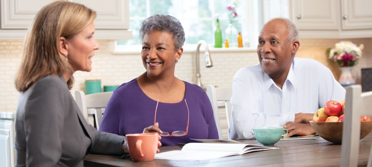 retirees talking with moving consultant