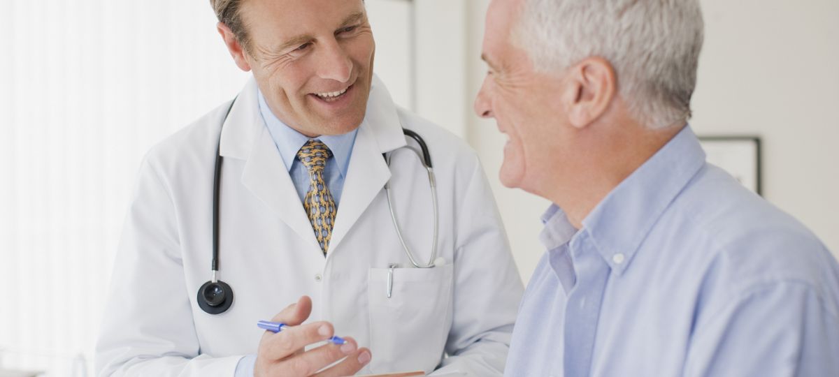 senior man talking with doctor
