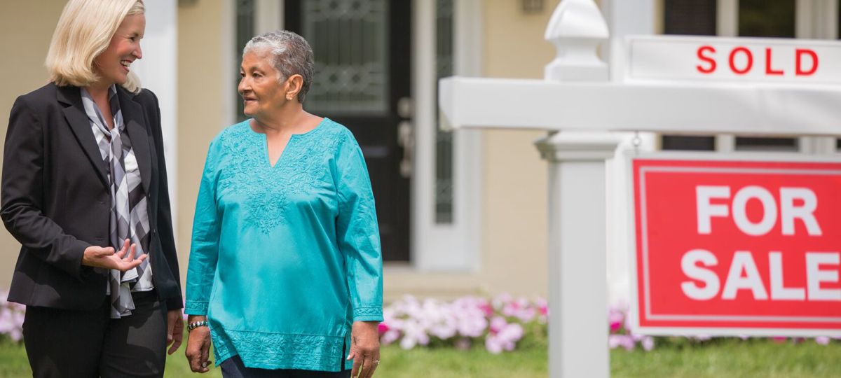 real estate agent with senior homeowner