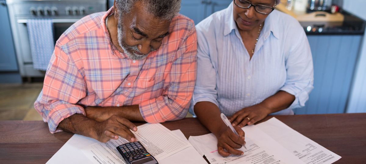 senior couple going through paperwork
