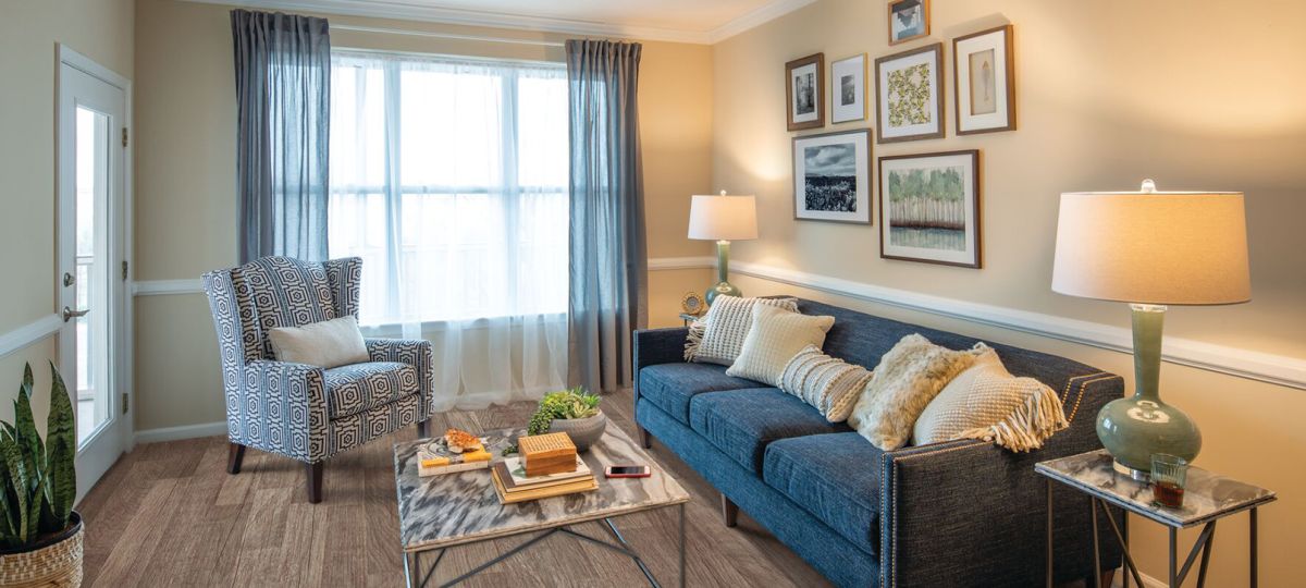 Comfortable and well-furnished living room in an Erickson Senior Living community apartment.