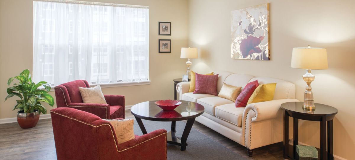 Comfortable and well-furnished living room in an Erickson Senior Living community apartment.