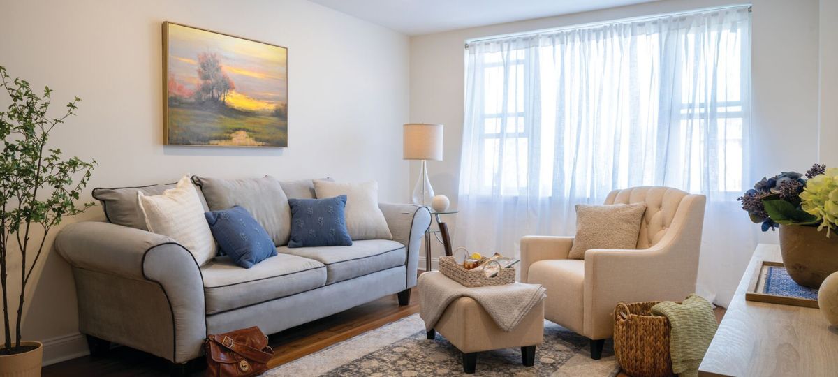 Comfortable and well-furnished living room in an Erickson Senior Living community apartment.